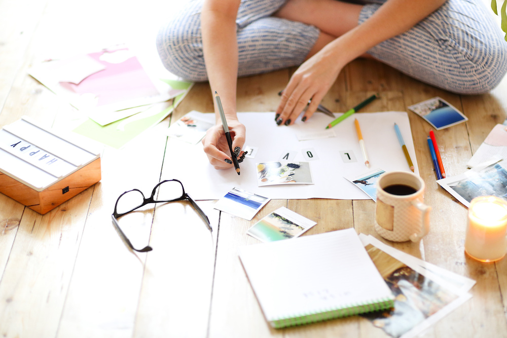 woman creating a vision board